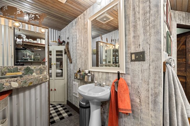 Bathroom with wooden ceiling and tile patterned floors | Image 36