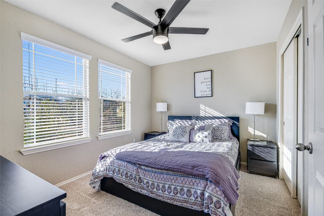Carpeted bedroom featuring a closet and a ceiling fan | Image 15