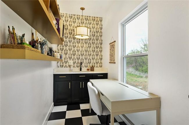 Bonus space for a hobby room or office. Has a sink and cabinetry for a coffee station or a place to rinse your paints if you are an artist. | Image 32
