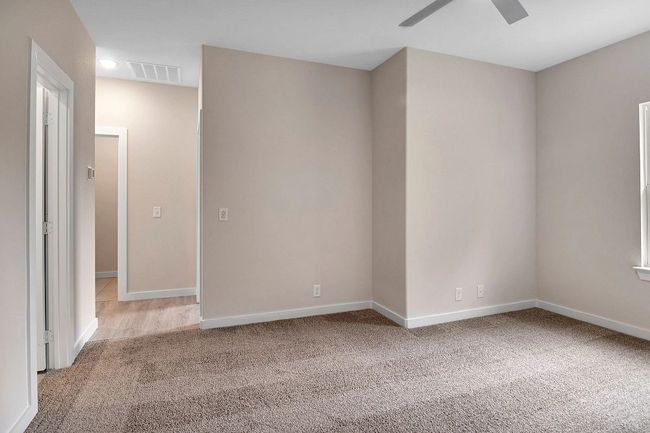 Empty room featuring light carpet and a ceiling fan | Image 18