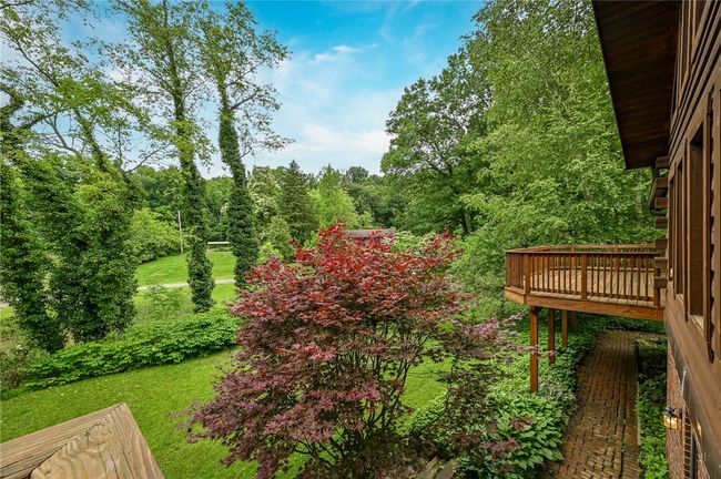 View from primary bedroom deck showing the larger deck. Both off the front of the property. | Image 26