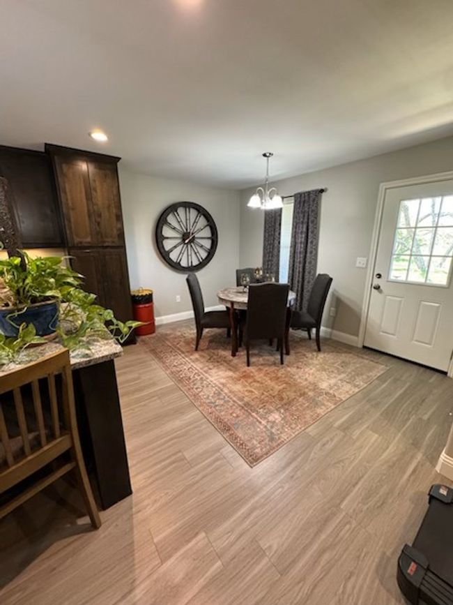 Dining space featuring a chandelier, recessed lighting, baseboards, and light wood-style flooring | Image 13