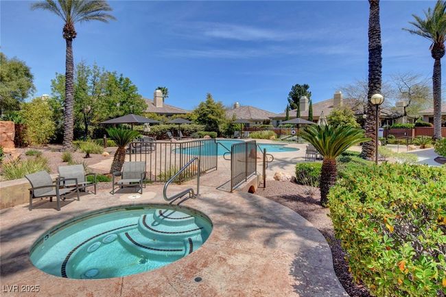 Community pool featuring fence and a patio area | Image 54