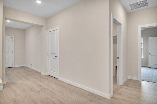 Hall featuring light wood finished floors and recessed lighting | Image 14