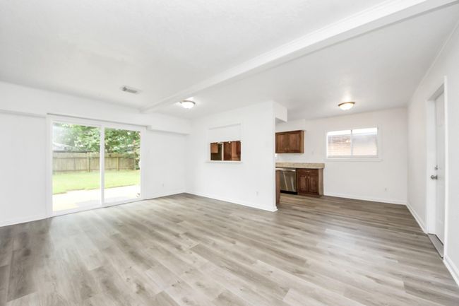 Luxury vinyl flooring throughout the house with carpet only in the bedrooms | Image 10