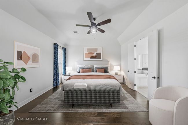 Bedroom with wood finished floors, ensuite bathroom, and ceiling fan | Image 14