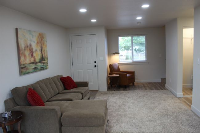 Living area featuring carpet flooring and recessed lighting | Image 5