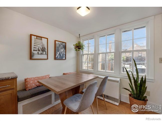 Eat-in kitchen has large windows towards the private backyard. | Image 16