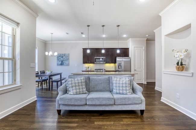 Living room flows seamlessly to kitchen. | Image 8