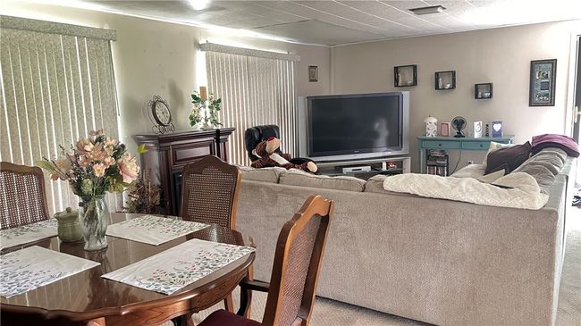 The family/dining room is spacious to host the holidays or family parties | Image 6