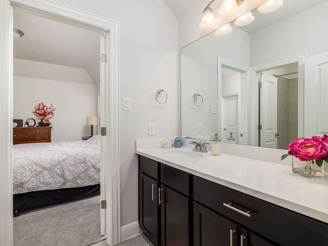 Ensuite bathroom featuring connected bathroom, vaulted ceiling, and vanity | Image 26