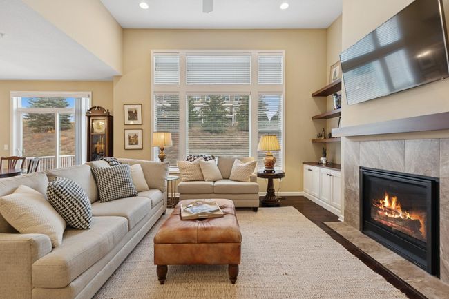 An abundance of light with oversized south facing windows & knockdown ceilings throughout! | Image 7