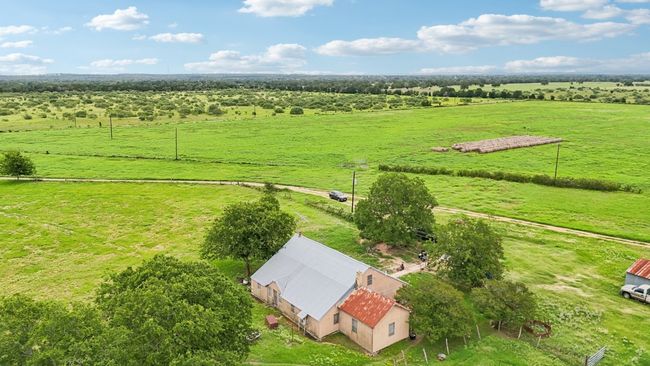 Aerial view of sparsely populated area with agricultural land | Image 5
