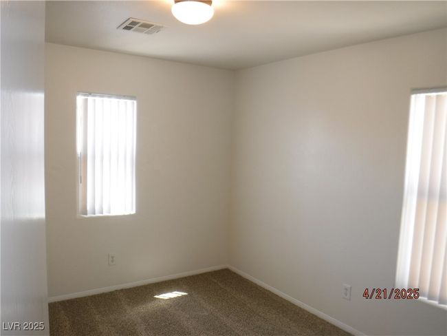 Bedroom with carpet flooring, baseboards, and new blinds | Image 11