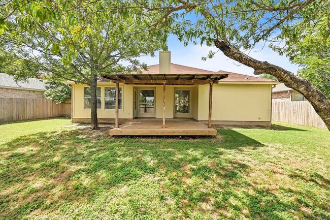Rear view of property featuring a pergola, a fenced backyard, and a deck | Image 28