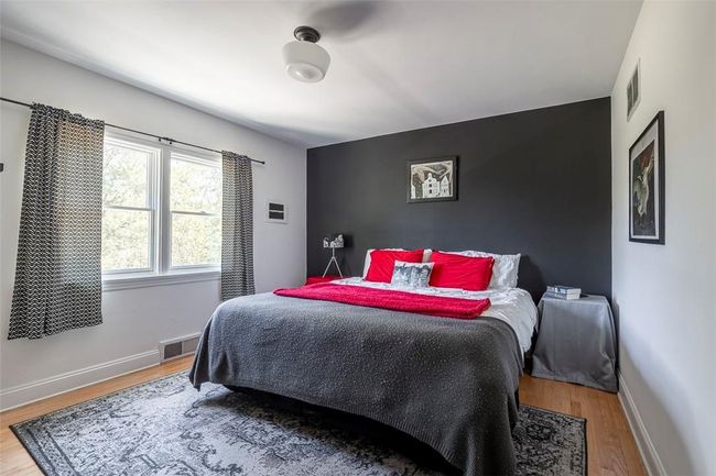 First floor bedroom with hardwood | Image 17