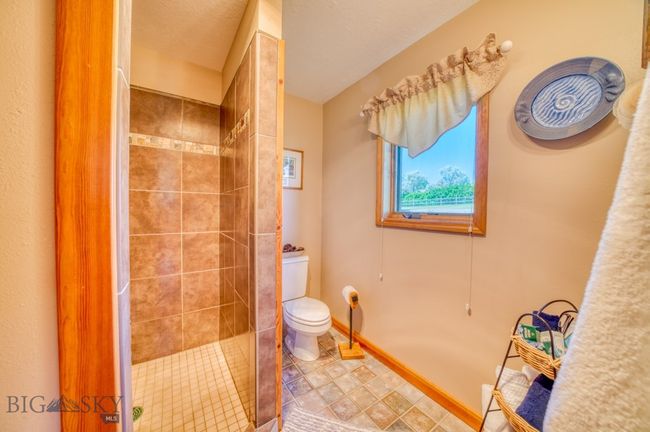 Primary ensuite bathroom with walk-in tiled shower | Image 20