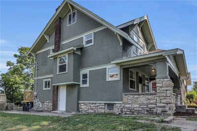 Rear view of property featuring a yard | Image 1