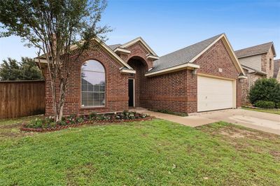 View of front of home with a garage and a front lawn | Image 2