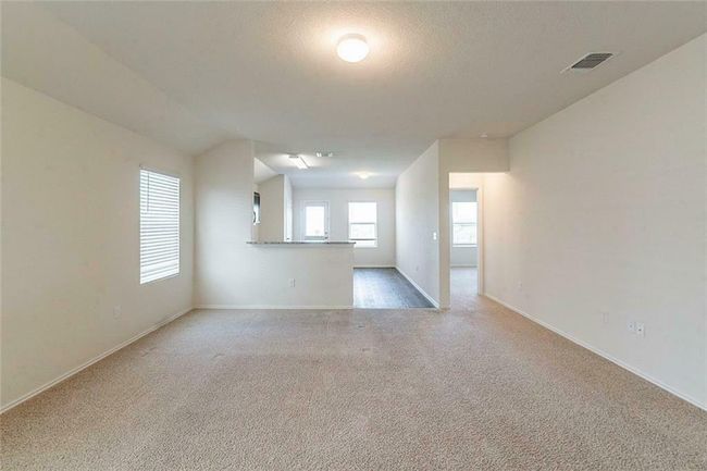 Spare room featuring carpet flooring and baseboards | Image 4