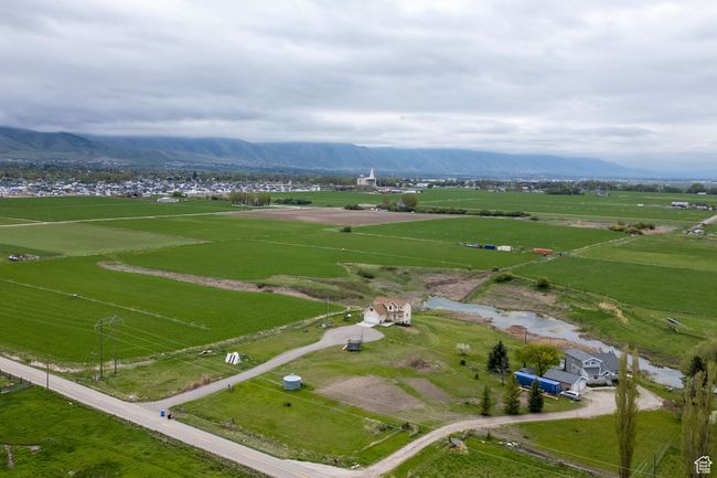 Aerial overview of property's location featuring rural landscape and a mountainous background | Image 28