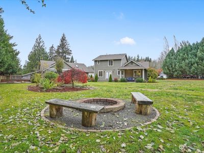 Host gatherings on the deck, covered patio, or around the firepit in the expansive yard. | Image 2