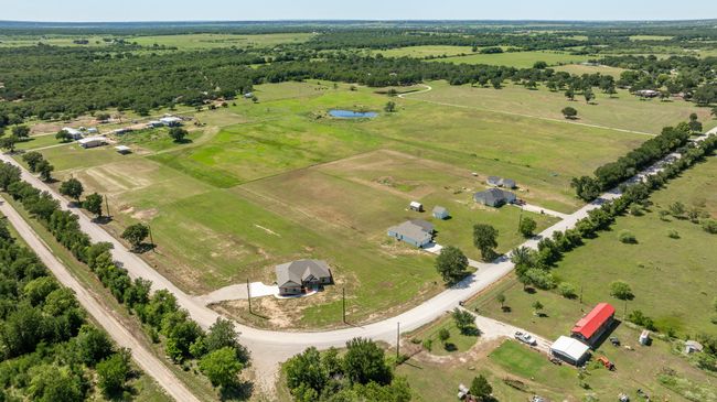 Aerial view of sparsely populated area featuring a large body of water | Image 37