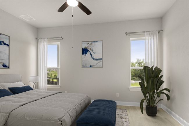 Bedroom featuring wood finished floors, baseboards, and ceiling fan | Image 23
