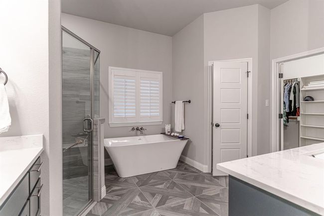 Bedroom with a tray ceiling, ceiling fan, and carpet floors | Image 21