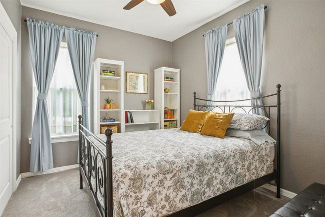 Bedroom 2 featuring ceiling fan, baseboards, and carpet floors | Image 18