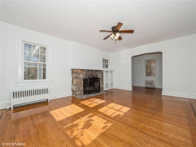 The working fireplace is the heart of this home. | Image 25