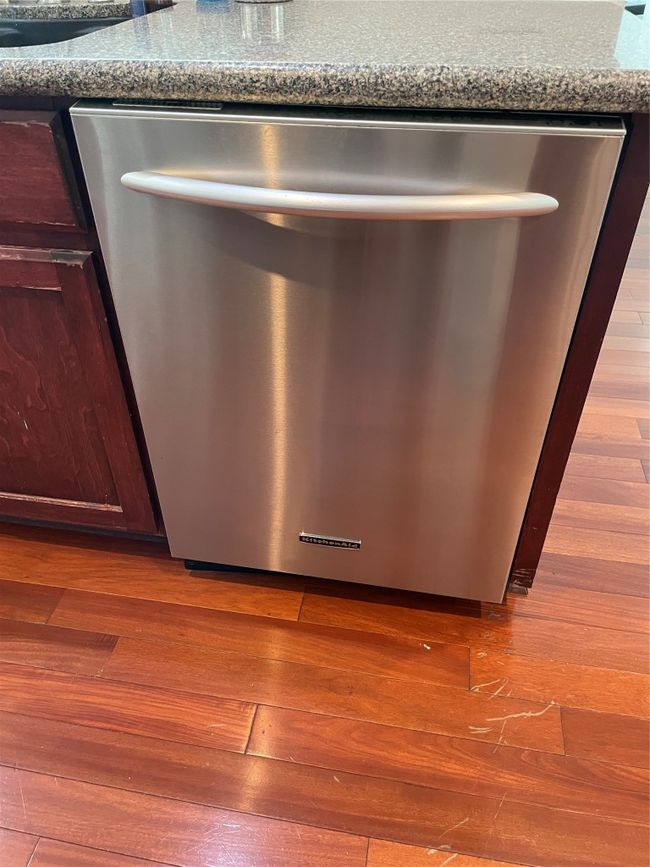 Kitchen view of dishwasher and wood finished floors | Image 14