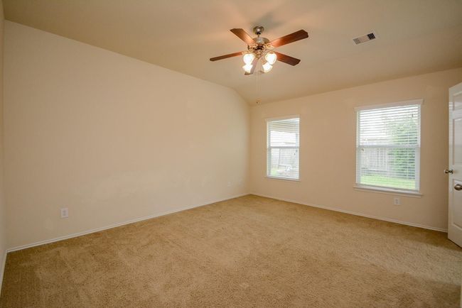 The master bedroom looks out to a private and tranquil view of thebackyard. | Image 17