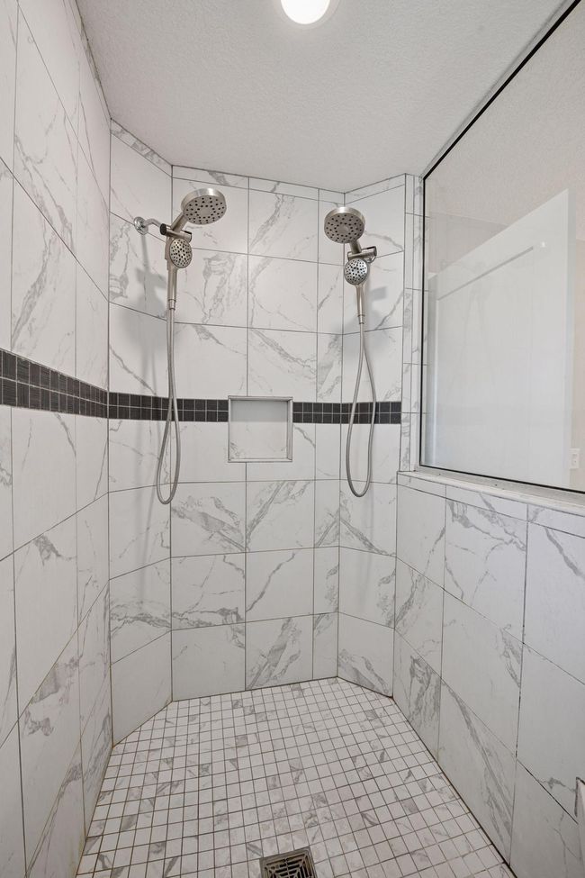 Beautifully tiled shower | Image 24