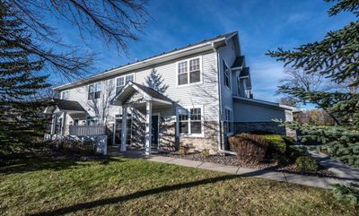 South facing front, covered front door area and private patio. | Image 2