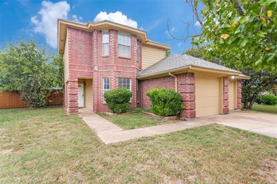 Front of property featuring a garage and a front yard | Image 3