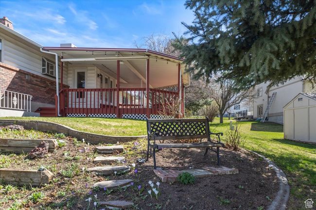 Back of house featuring a shed, a yard, and an outdoor structure | Image 35
