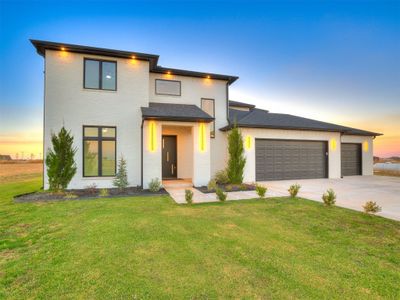 View of front of house with a yard and a garage | Image 1