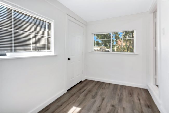 Unfurnished bedroom with wood finished floors and a closet | Image 10