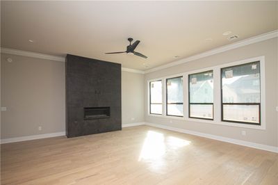 The polished engineered hardwood flooring adds a touch of sophistication, completing the inviting atmosphere of this remarkable living area. | Image 3