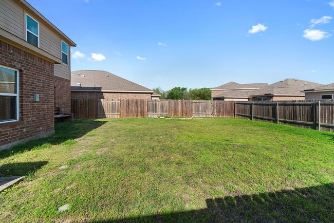 View of yard with a fenced backyard | Image 32