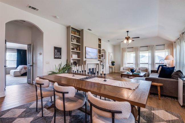 Just to the side of the dining is the double door entry to the master! The other bedrooms that are downstairs are located just past the built ins off a hall that also boast luxury vinyl plank flooring! | Image 6