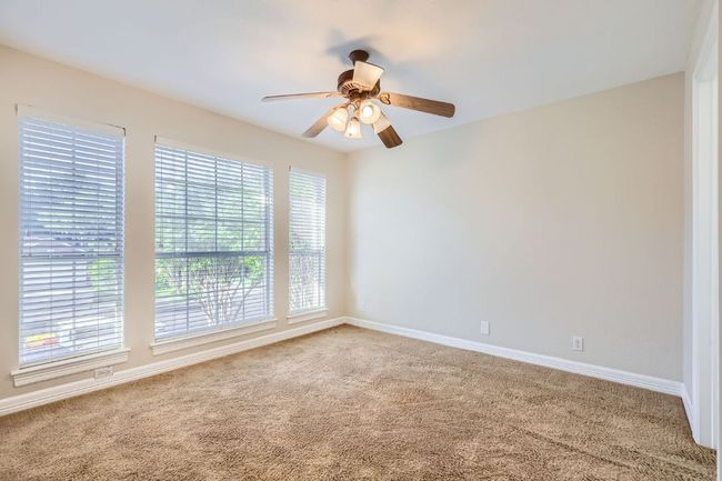 Unfurnished room with ceiling fan, carpet, and baseboards | Image 30