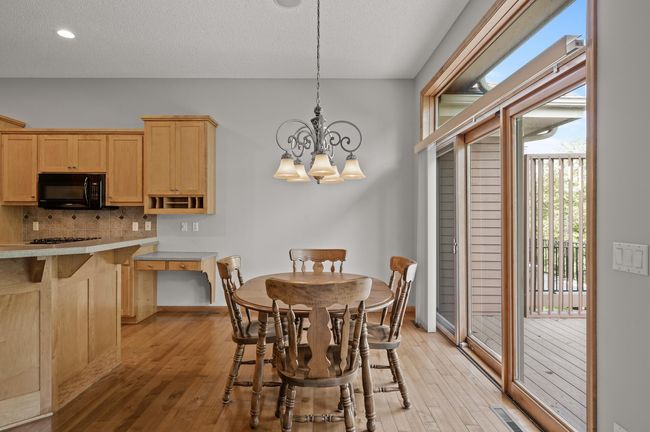 Dining area walks out to the oversized, composite deck to expand entertaining options. | Image 10