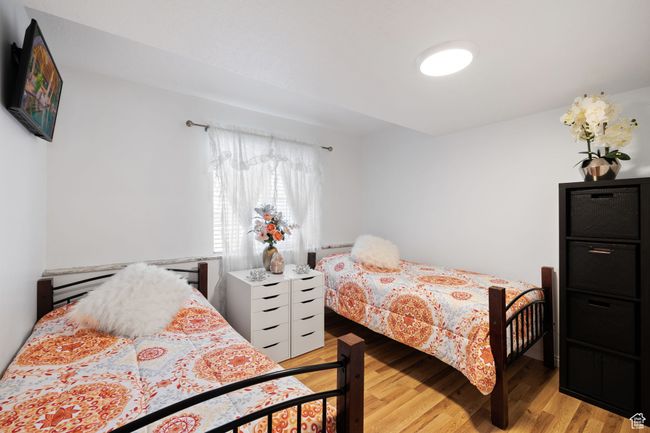 Bedroom featuring light wood-type flooring | Image 30