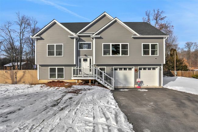Split foyer home featuring a garage | Image 33
