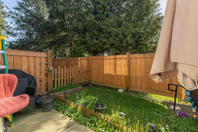 View of fenced backyard | Image 11