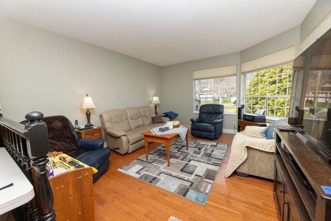 Living room featuring wood finished floors | Image 6