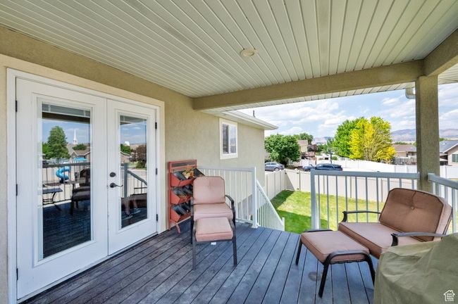 Deck with french doors and a fenced backyard | Image 23