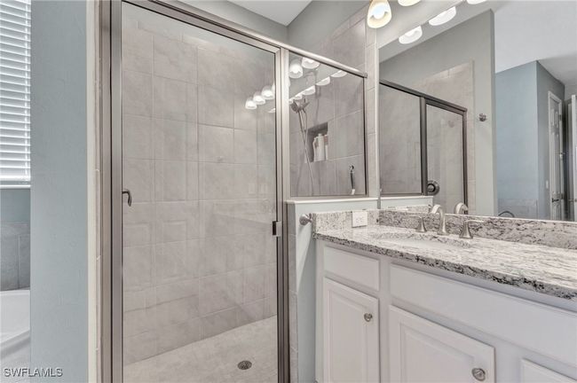 Full bath featuring a shower stall and vanity | Image 40